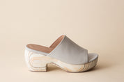Off-white clog sandal on a beige background