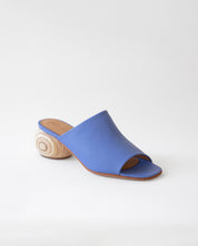 Blue sandal with wooden heel on a white background