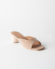 Beige sandal with wood heel on a white background