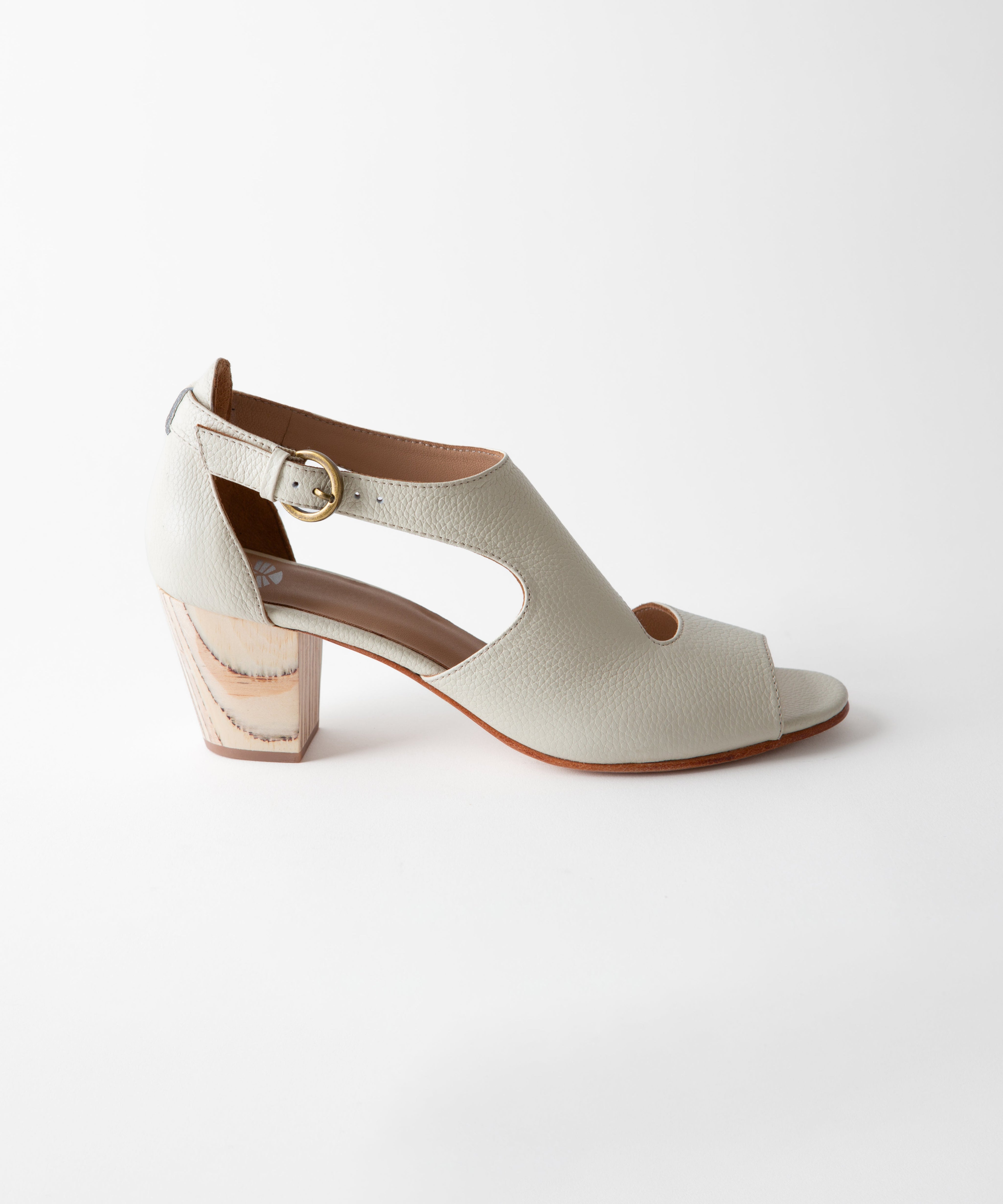 White sandal with a block heel on a white background