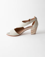 White sandal with a wooden heel on a white background